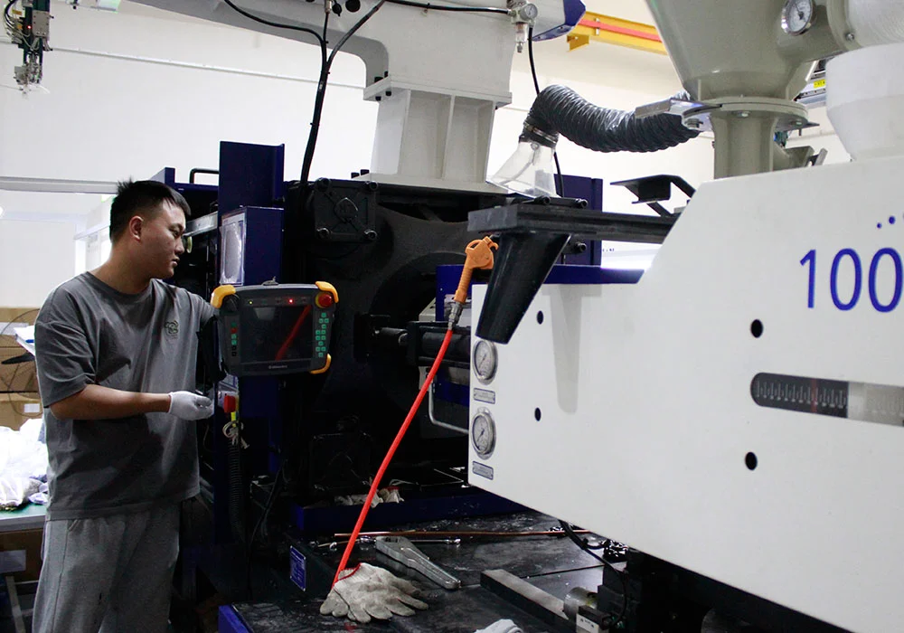 Injection molding machine being set up at Agilian