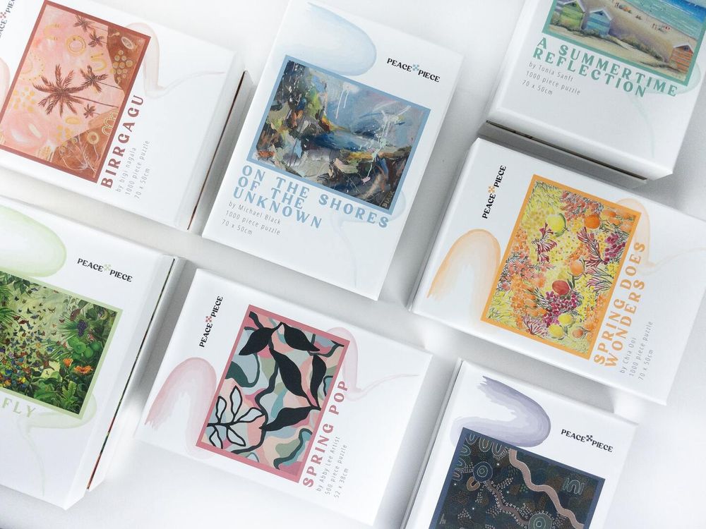 Printed rigid puzzle boxes made for Peace x Piece Puzzles