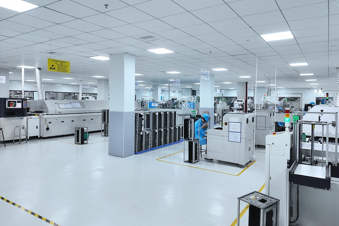 Bright SMT workshop with reflow ovens and assembly machines