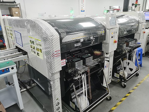 Pick-and-place machine with component feeders on an SMT line