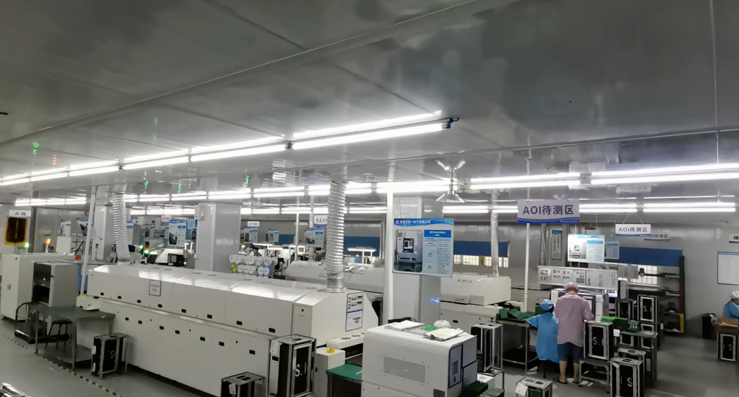 SMT floor with reflow ovens and an AOI inspection area