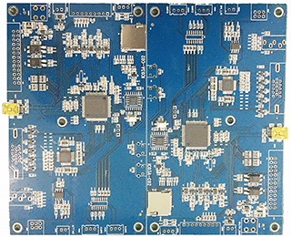 Assembled blue circuit board with several ICs and connectors