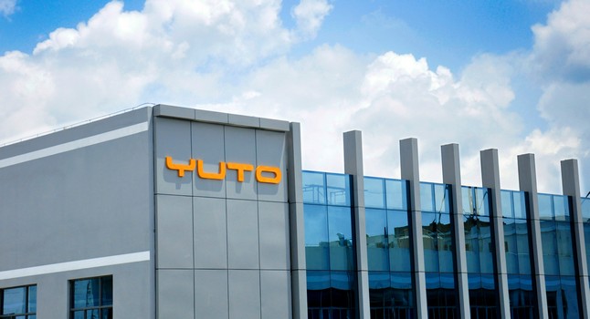 YUTO building with the orange YUTO sign on its facade
